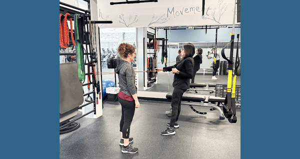 personal training discussing movement techniques with a student