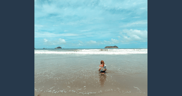 Cassie's son in the Pacific Ocean in Costa Rica living the Pura Vida life.